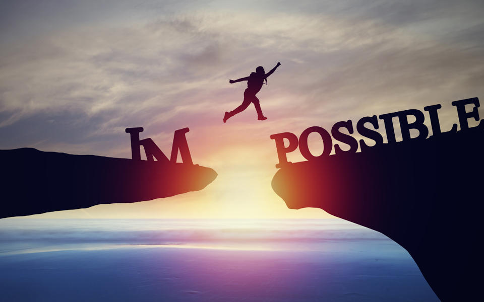 Concept of success in business and leadership is possible. Person jumping from cliff to another showing concept of success in business and leadership