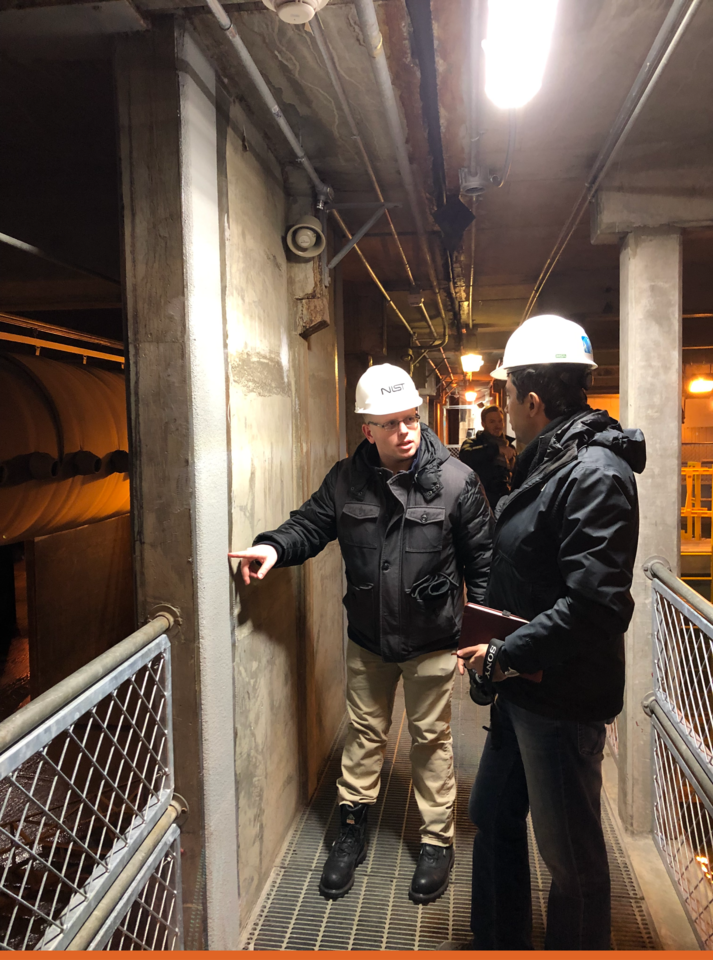 David Goodwin (left)  and Siamak Sattar from NIST’s Materials and Structural Systems Division examining a wall at the Anchorage Water and Wastewater Treatment Plant after an earthquake in Alaska 2019.