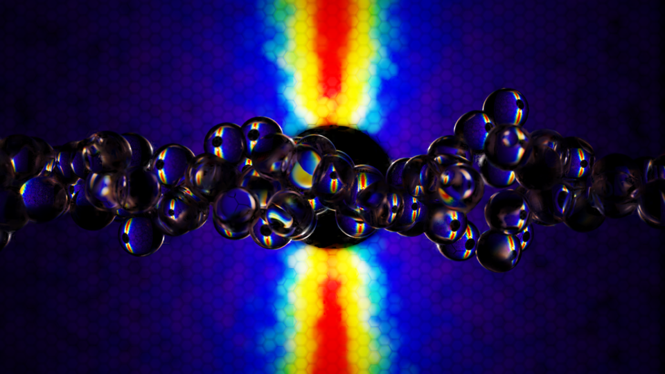 Colorful computer data patterns form a backdrop to a horizontal string of transparent spheres.