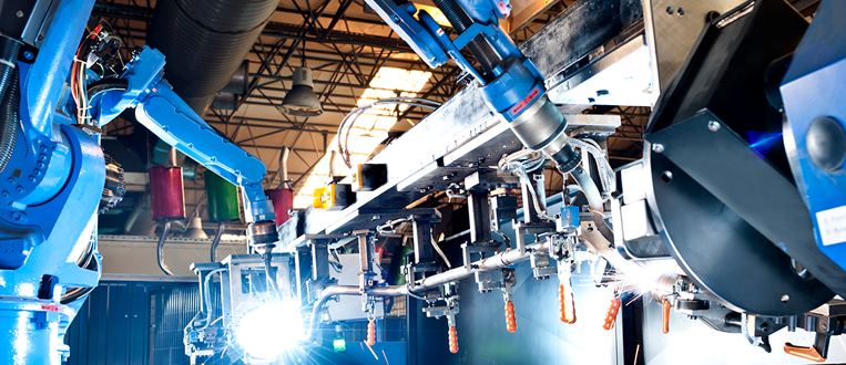 Industrial robot in a manufacturing facility stock photo