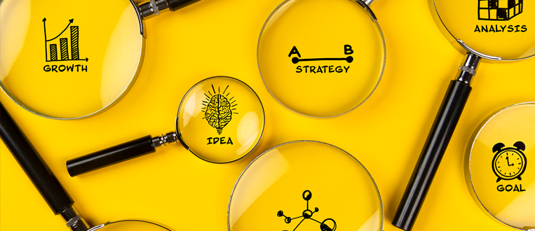 business plan concept with icons and magnifying glasses