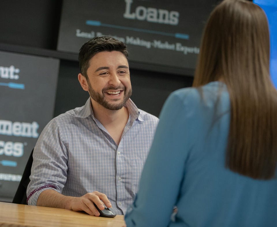 Elevations Credit Union 2020 Baldrige Award Recipient in Nonprofit showing a bank employee helping a customer with their account.