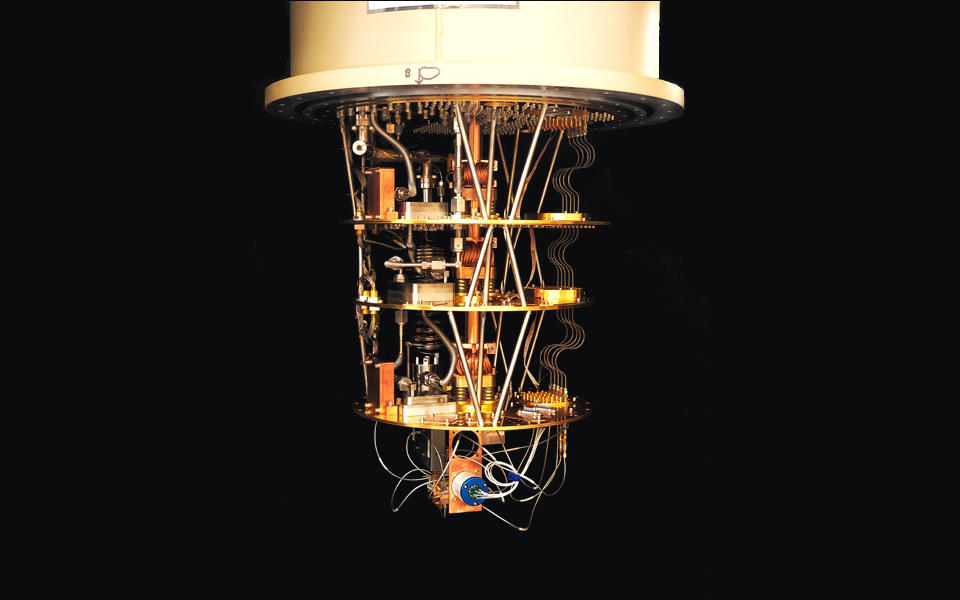 the cryogenic quantum testbed, a sophisticated metallic gold electronic device 