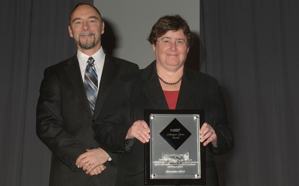 Photo of Ellen Garshick receiving her 2013 Colleagues Choice Award from Baldrige Program Director, Bob Fangmeyer.