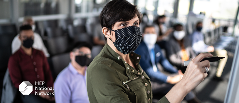 Businesswoman speaking at a business conference with face masks