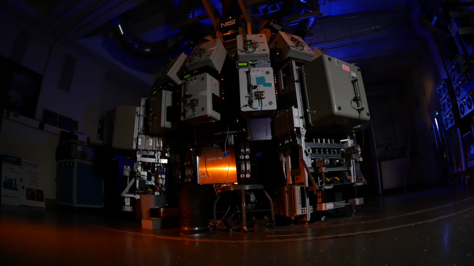 Spherical object in darkened lab is covered with scientific devices.