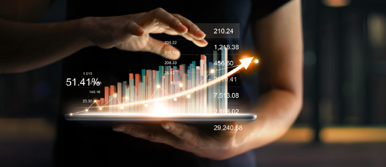 Businessman holding tablet and showing a growing virtual hologram of statistics, graph and chart with arrow up on dark background. 