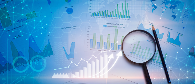 Magnifying glass and documents with analytics data lying on table , and digital virtual reality graph