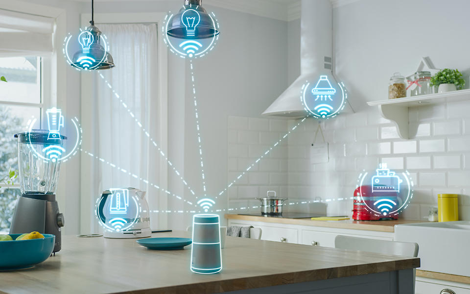 a kitchen with a voice activated assistant on the counter, graphics indicate that it is connected wirelessly to the stove, the toaster, the blender and so on. 