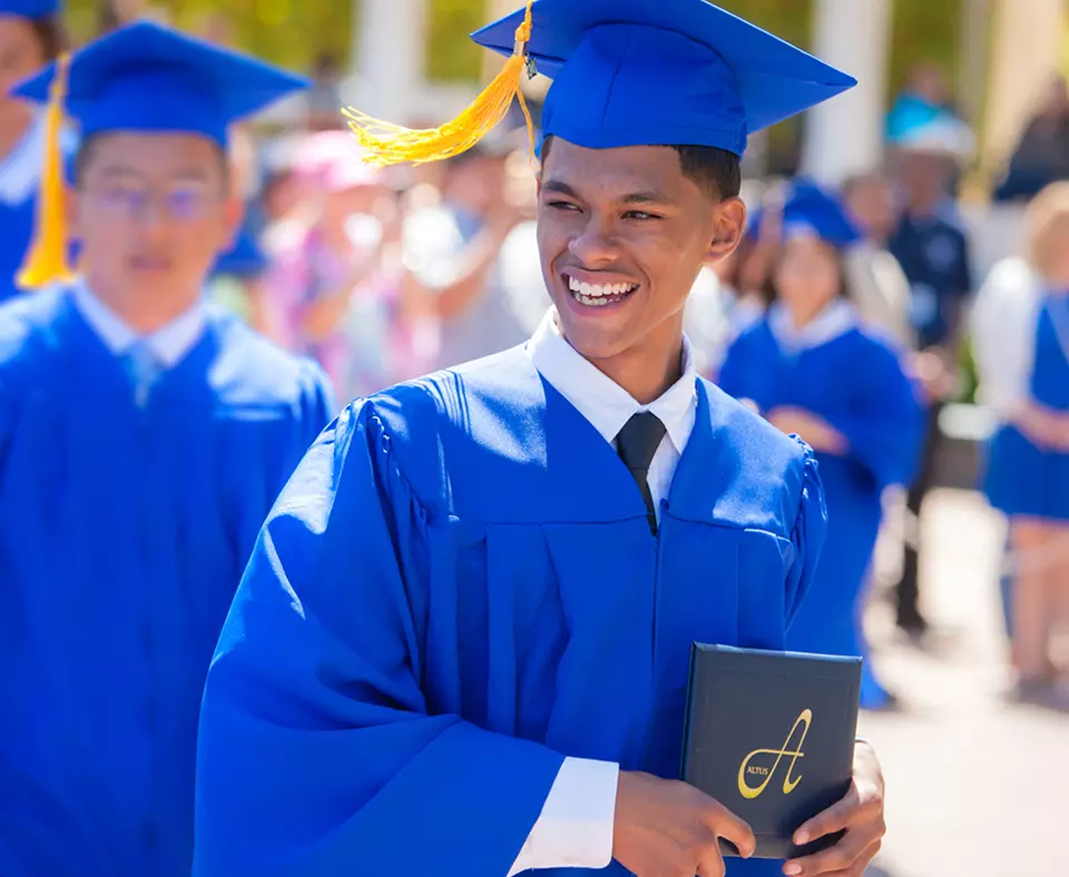 The Charter School of San Diego photo showing a male student graduating.