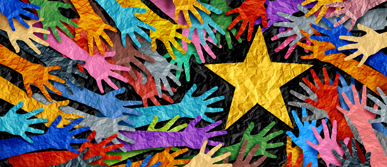 multi colored hands reaching towards a star for a success in business concept