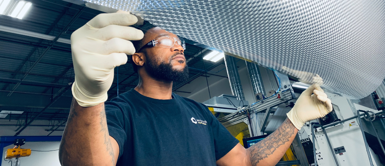 african american worker in a manufacturing facility