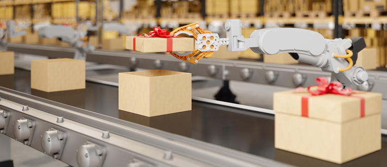 Robotic Arm Putting The Cover Of Gift Box On The Conveyor Belt