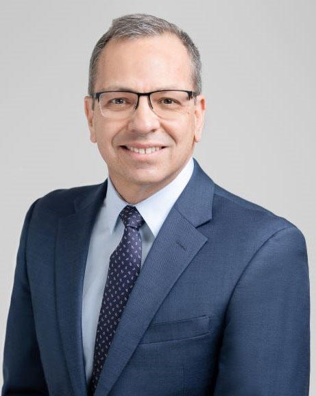 headshot of a man in a suit