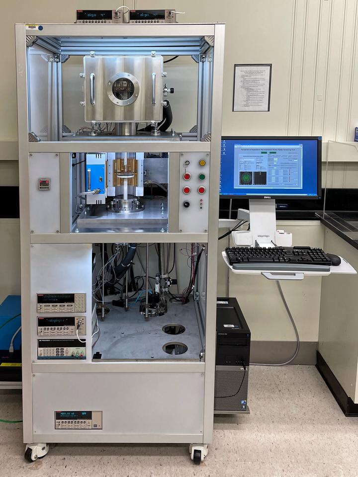 hotograph of the custom high temperature (>300 K) scanning instrument that measures electrical resistivity and Seebeck coefficient 