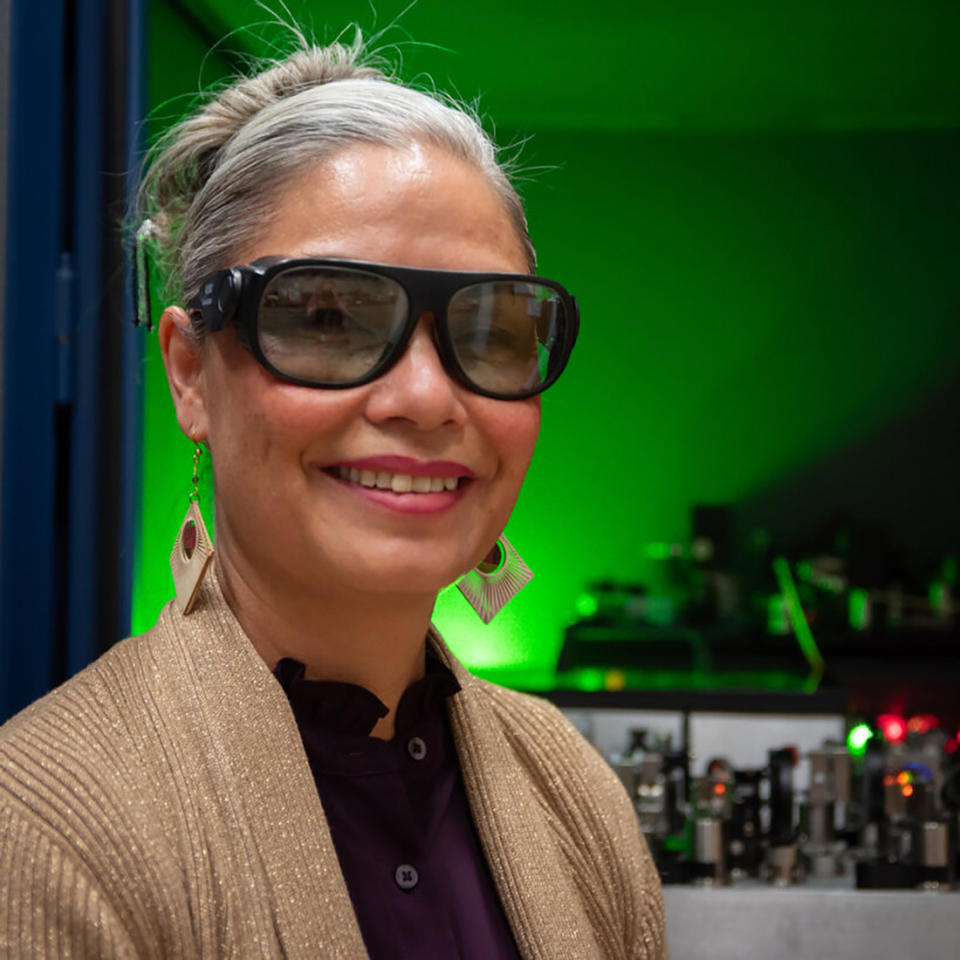 Tara Fortier wears safety glasses as she poses in the lab for a portrait.