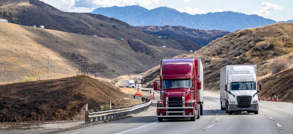 two trucks on highway