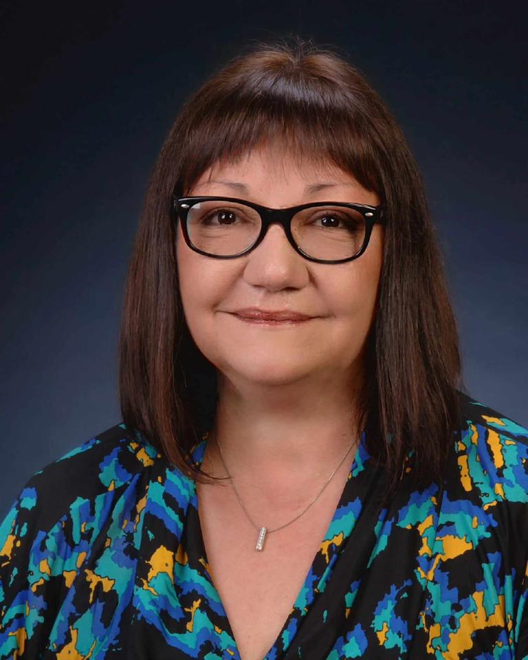 woman with brown hair wearing glasses