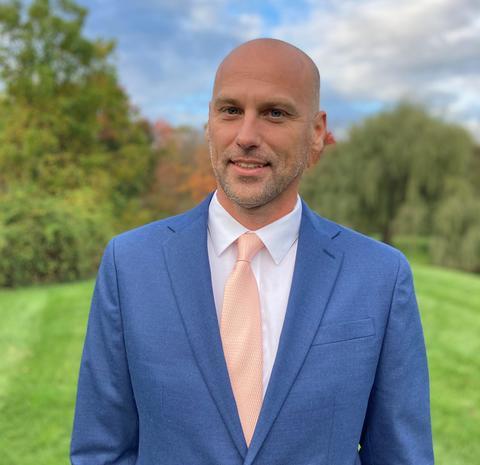 Man outside in blue suit