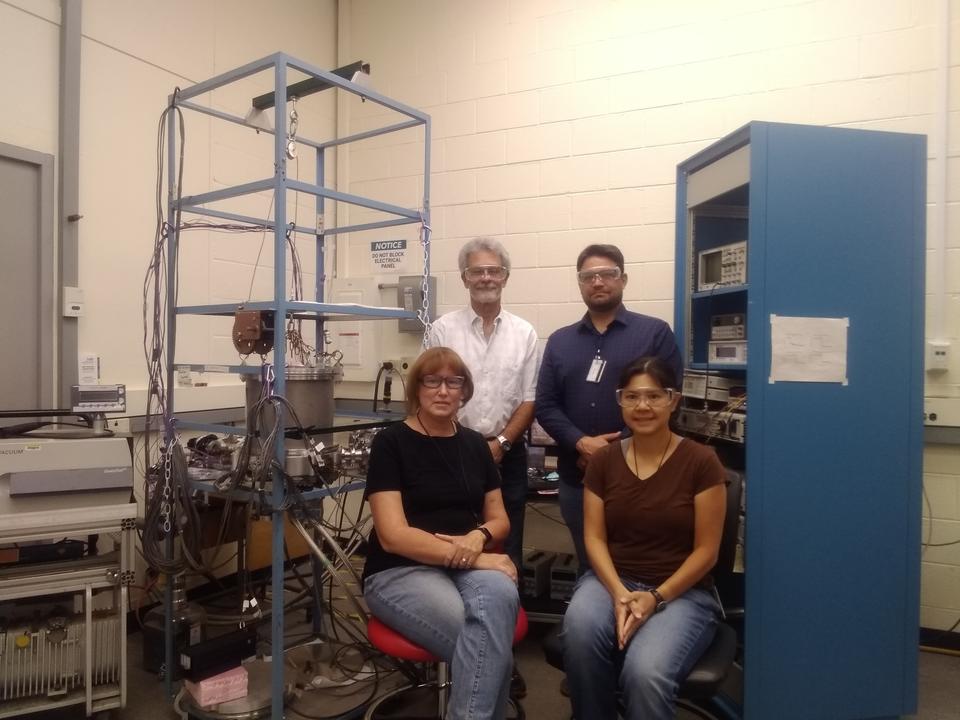 Four people in a laboratory
