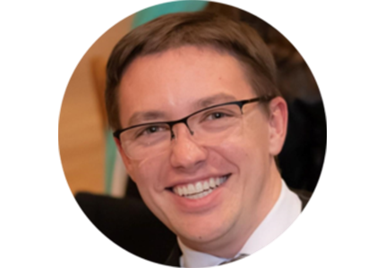 Alec Saville, person with short brown hair and glasses
