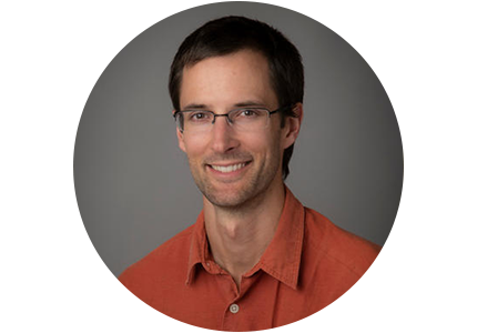 Benjamin Caplins, person with short brown hair and glasses