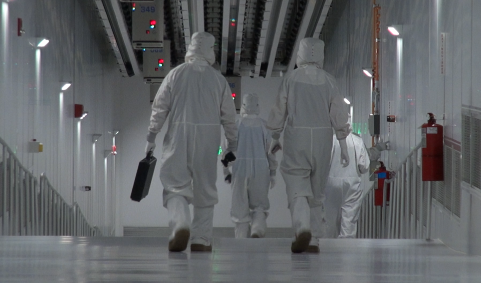 Photo of employees walking inside the fab facility in New York