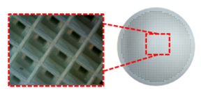 An additively manufactured ceramic Radio Frequency (RF) device. Close up view shows the 3D printed ceramic surface was printed in a gridded pattern. 
