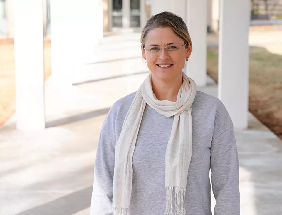 Justyna Zwolak poses for a casual photo outdoors on the NIST campus.
