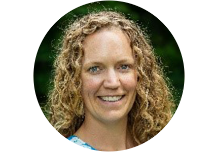 Headshot of Kelsea Schumacher, a woman with long curly blonde hair, smiling