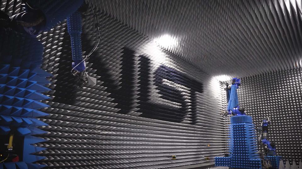 Photo of antenna lab with  NIST logo in the background