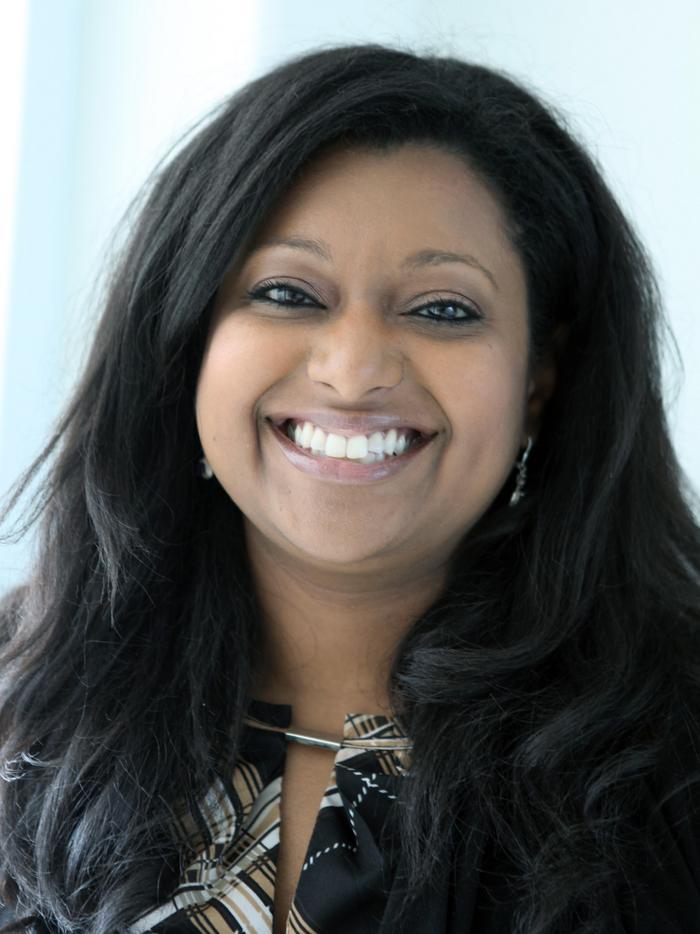 Headshot of Samantha Maragh, a woman with long dark hair, smiling 