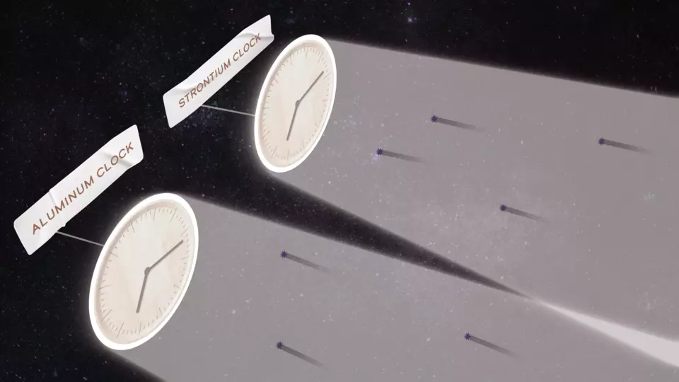 Illustration shows two clocks labeled "Aluminum" and "Strontium" moving through space, highlighting particles of dark matter in their wakes. 