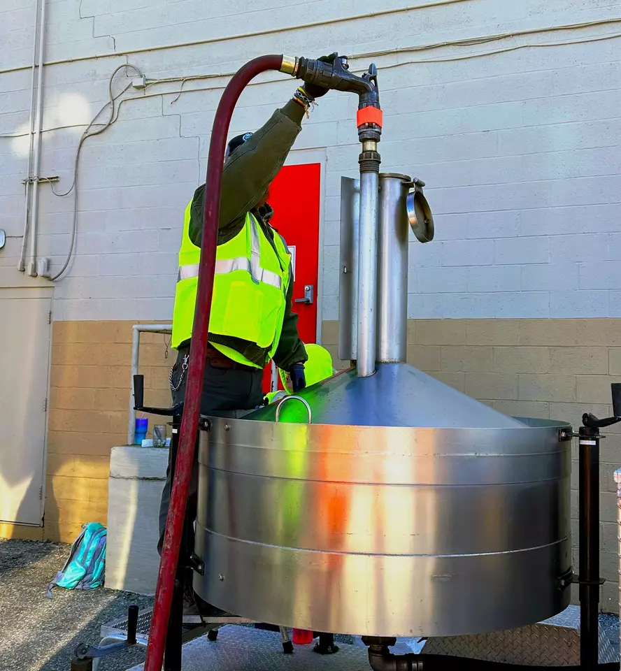 photo of a man holding pump