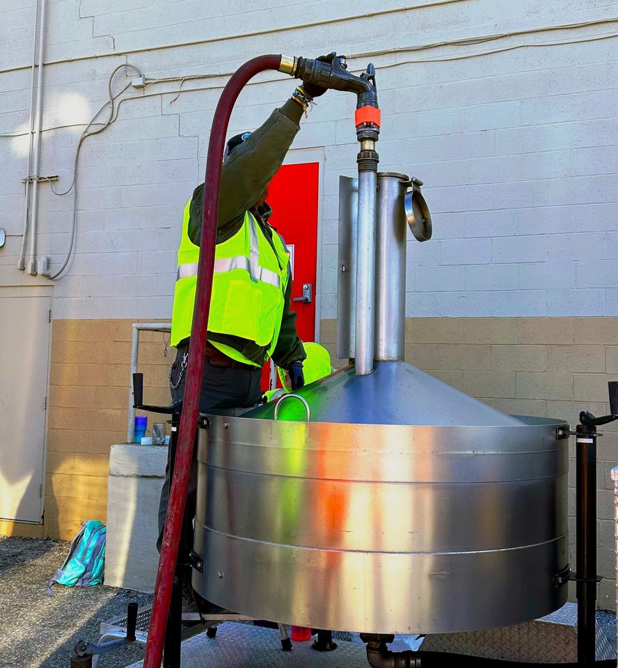 photo of a man holding pump