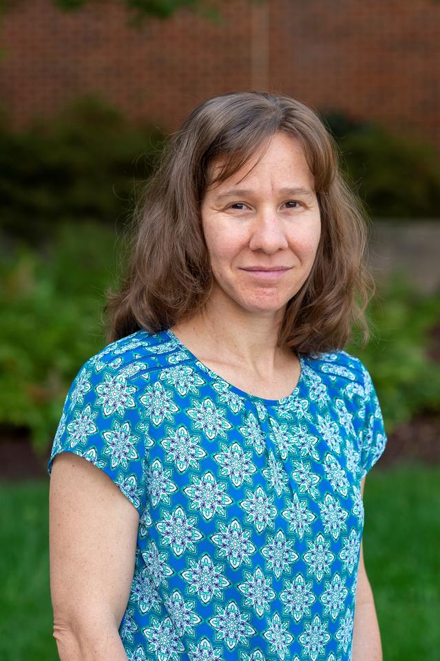 smiling woman with brown hair