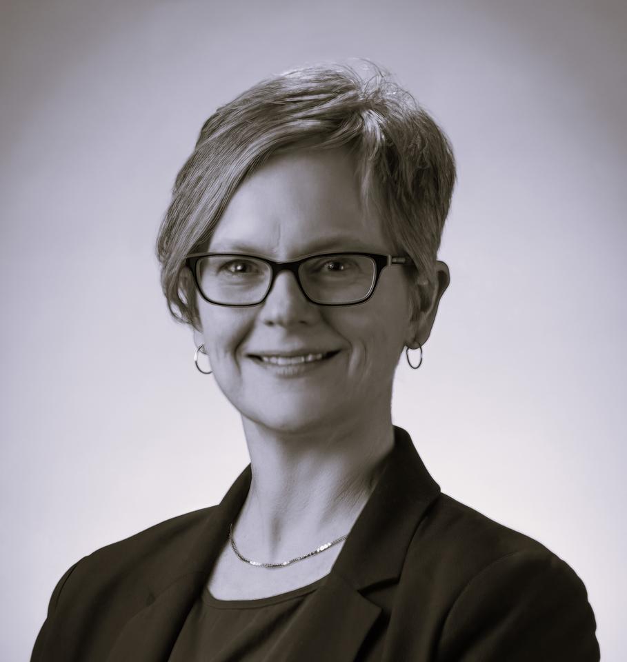 Black and white professional headshot of Kate Beers