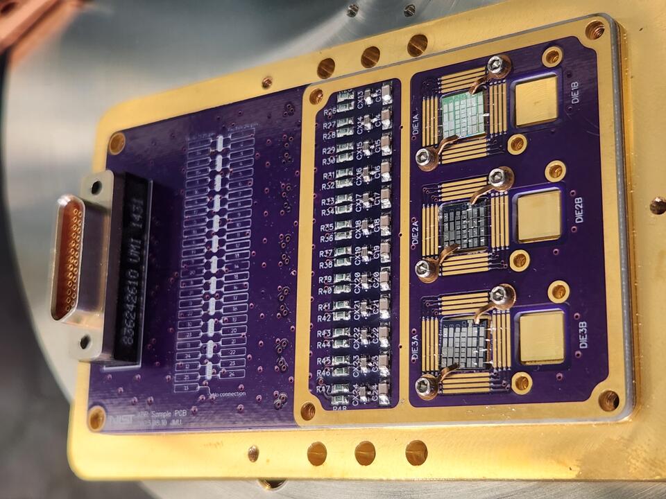 Thermometer chips is one of several square chips integrated into a rectangular holder with a circuit board.