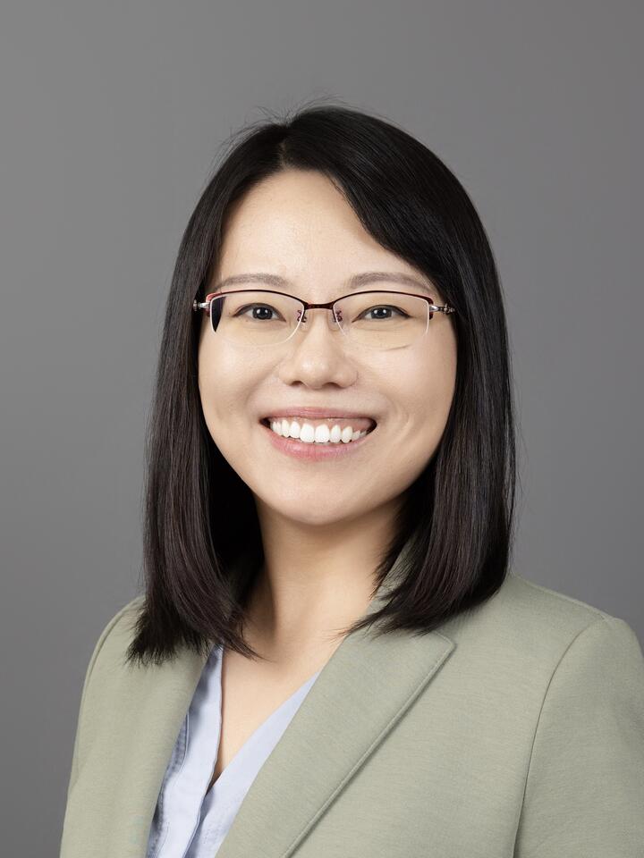 Professional headshot of Ran Tao, a woman with medium length, dark hair and glasses, smiling.