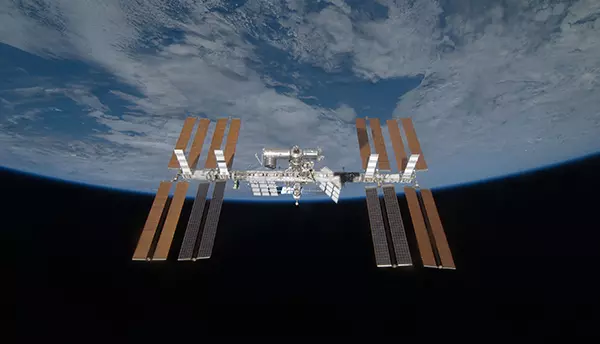 View of the International Space Station with the curve of the Earth in the background. 