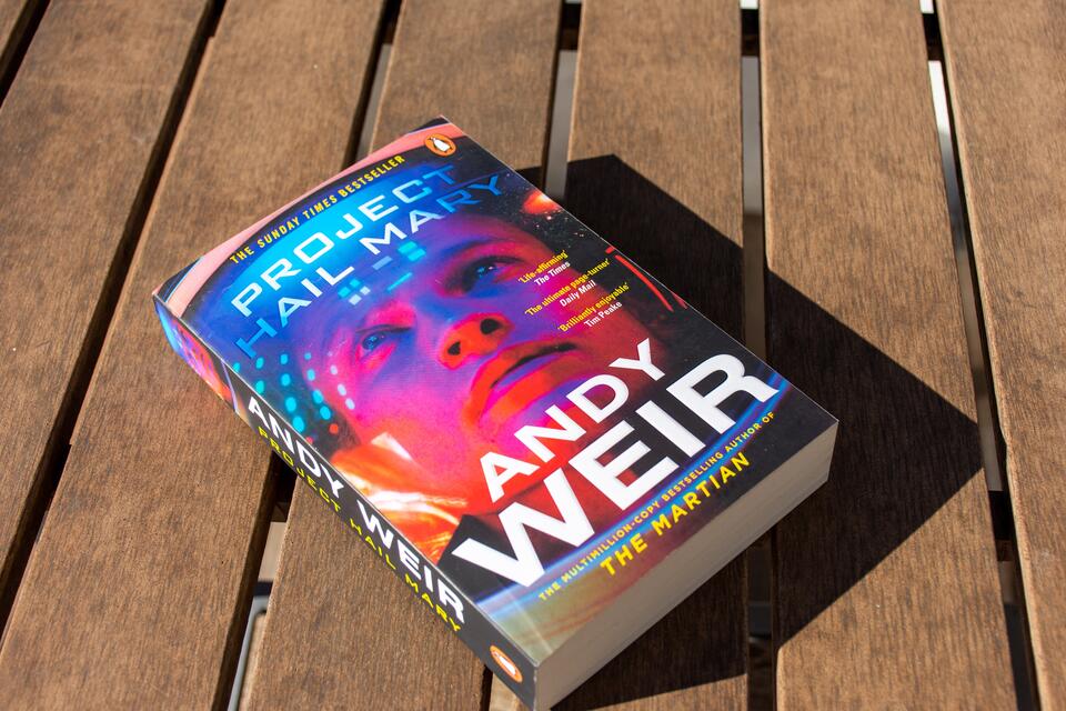 The novel Project Hail Mary sits on a table. 