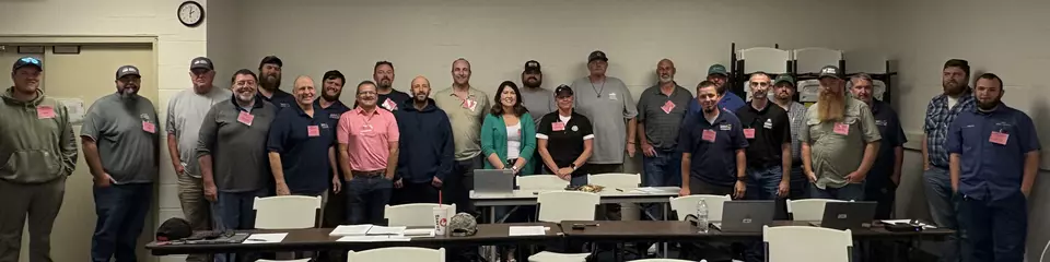 class photo of students in the Vehicle and Axle-load Scale training
