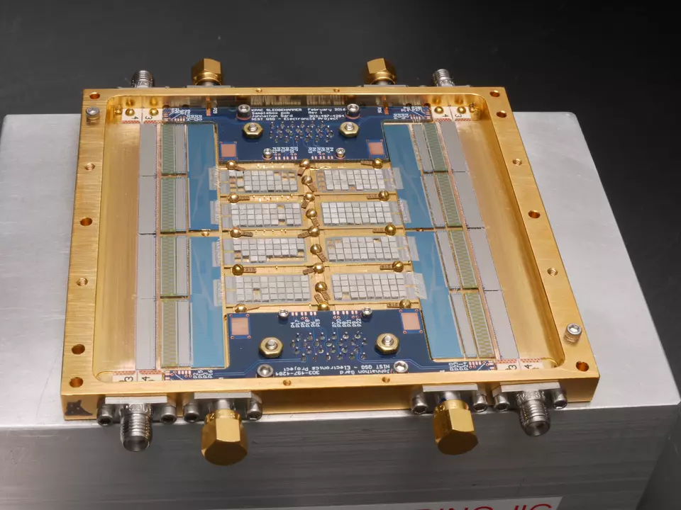 An array of sensors appear as a set of rectangles within a gold-colored metal frame.