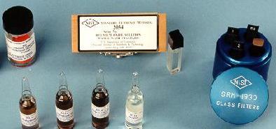Photograph of reference materials consisting of vials, bottles and cuvette filters 
