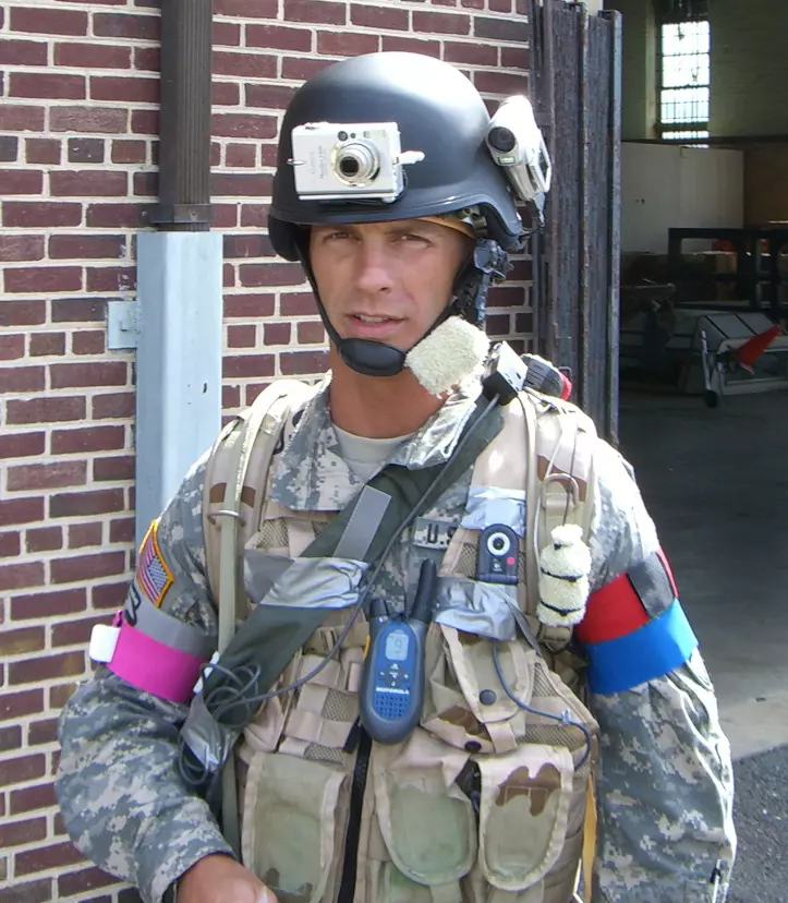 Man wearing helmet and soldier gear
