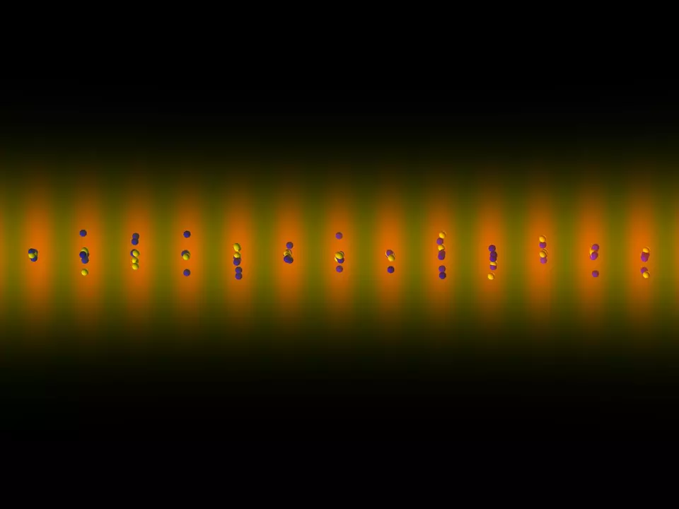 Black background with a horizontal line of atoms