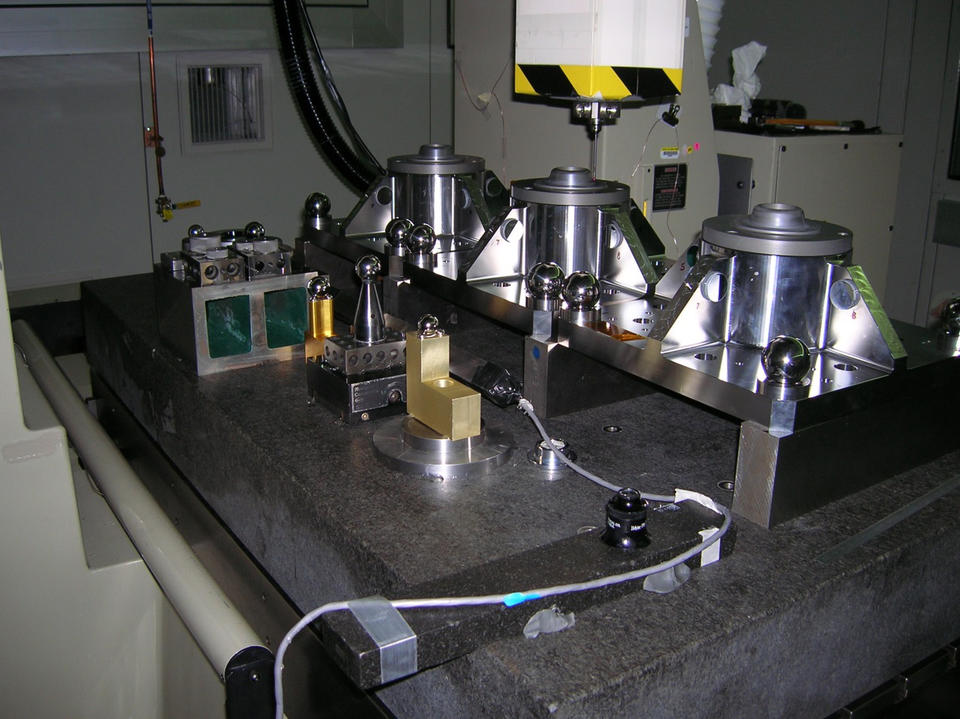 Three of the four James Webb Space Telescope Primary Mirror Backplane Support Structure fixtures on the NIST M48 Coordinate Measuring Machine.