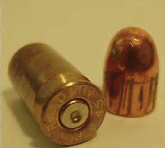 A fired cartridge case and a fired bullet.