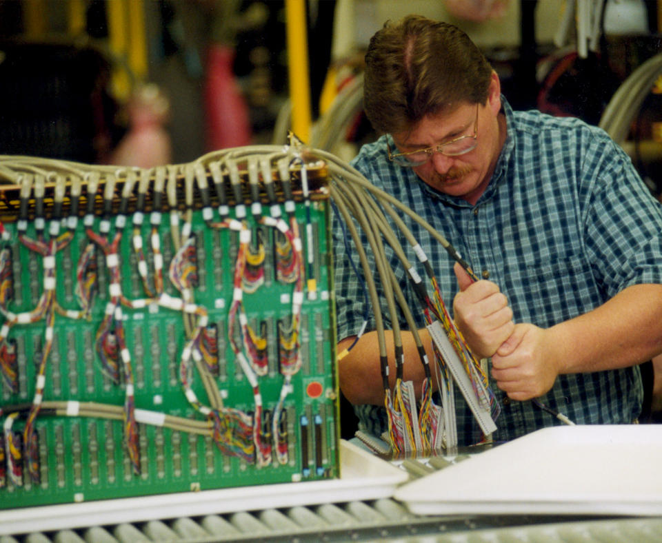 KARLEE Company, Inc. photo of man working on machined components for customers.