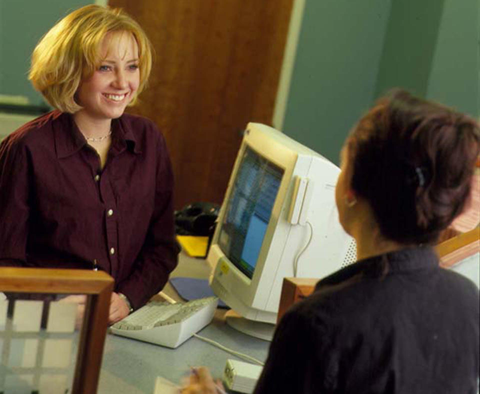 Los Alamos National Bank photo of two women doing a bank transaction.